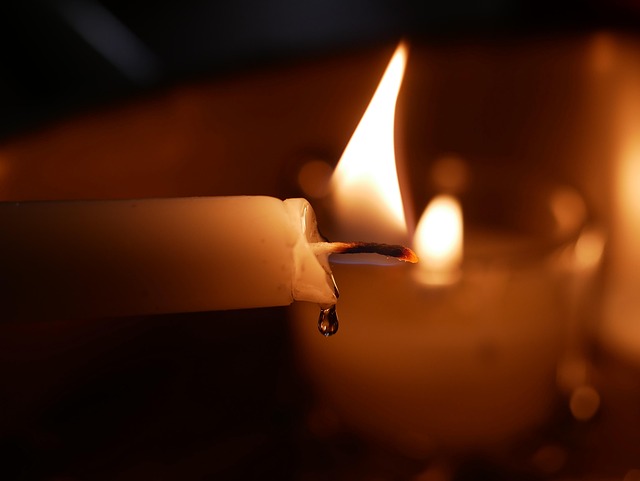 Close-up of a lit memorial candle symbolizing healing and support from funeral homes Prosper, TX.