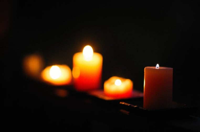 Warm candlelight creating a peaceful memorial setting in Little Elm, TX.