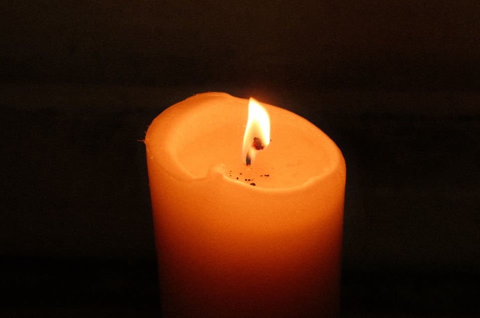 Lit candle representing a formal cremation ceremony in Frisco, TX.
