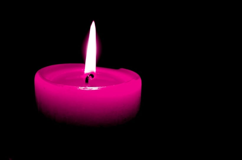 Pink memorial candle representing remembrance after loss in Little Elm, TX.